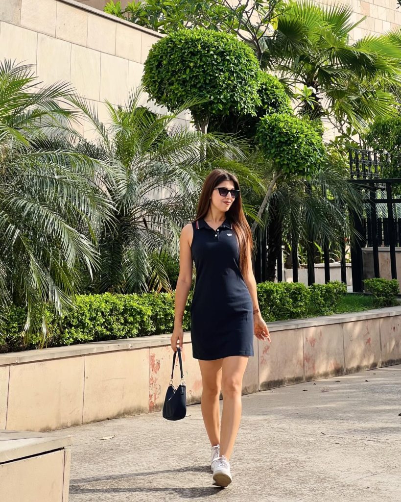 Black Polo Dress + White Sneakers + Small Handbag