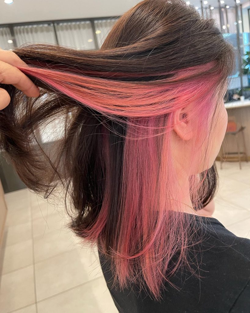 Pink Highlights on Short Brown Pixie Hair