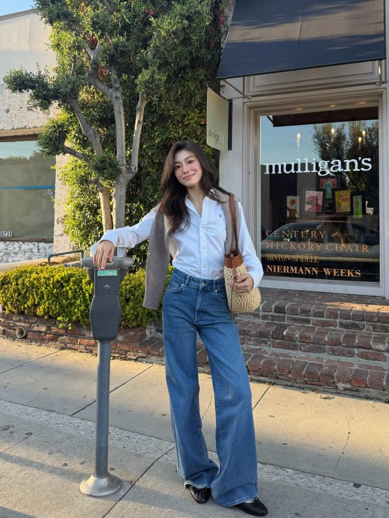 White Button-Up Shirt + Wide-Leg Jeans + Neutral Shoulder Sweater