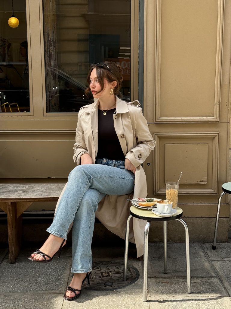 Beige Trench Coat + Black Top + Light Wash Jeans