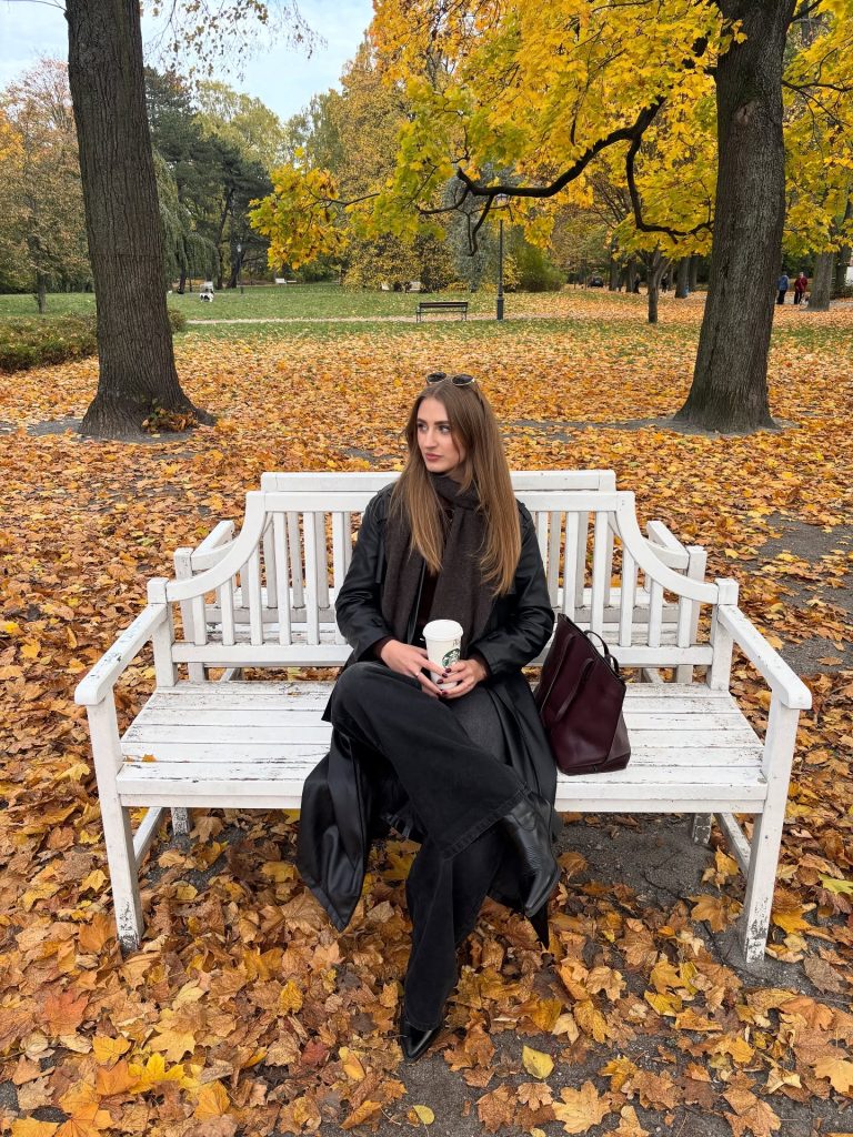 Black Leather Trench Coat + Black Wide-Leg Jeans + Dark Scarf