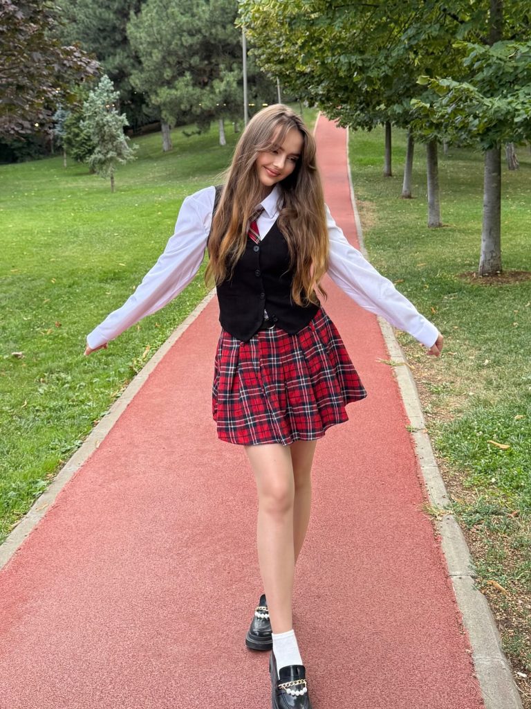Black Vest + White Long-Sleeve + Red Plaid Skirt